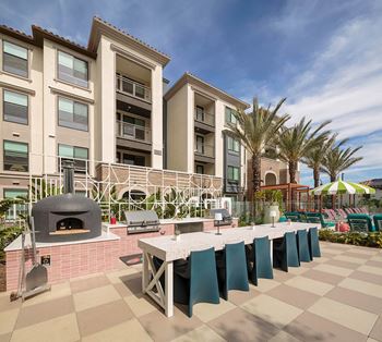 Xanadu: pool side cabana with kitchen, hang out spaces, and food trailer on outdoor patio